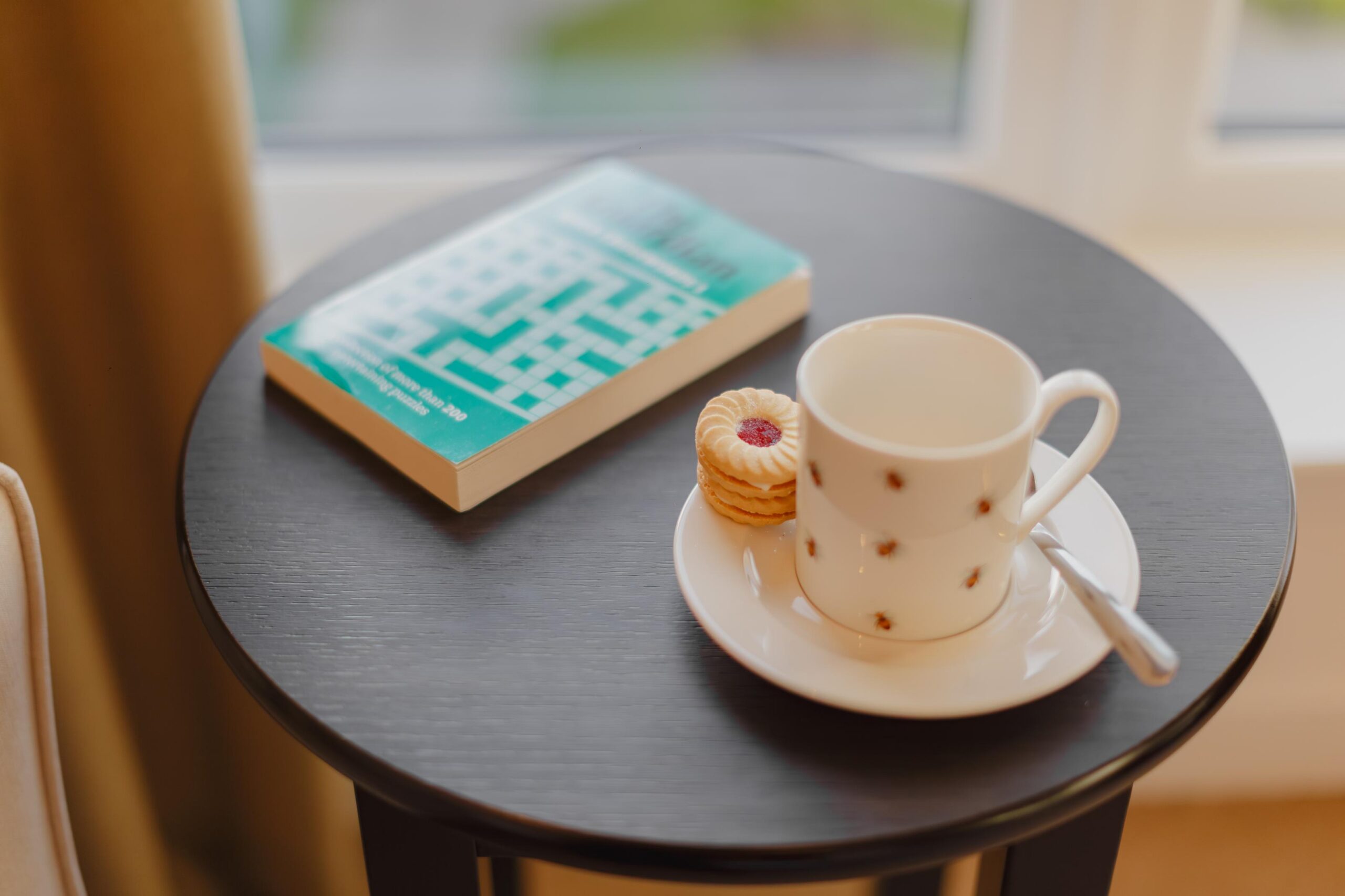 cup of tea and a book on a table