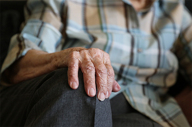 resident-with-hand-on-his-knee