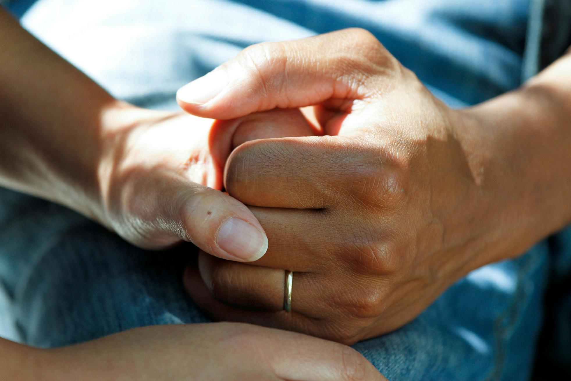 nurse holding hands with a resident