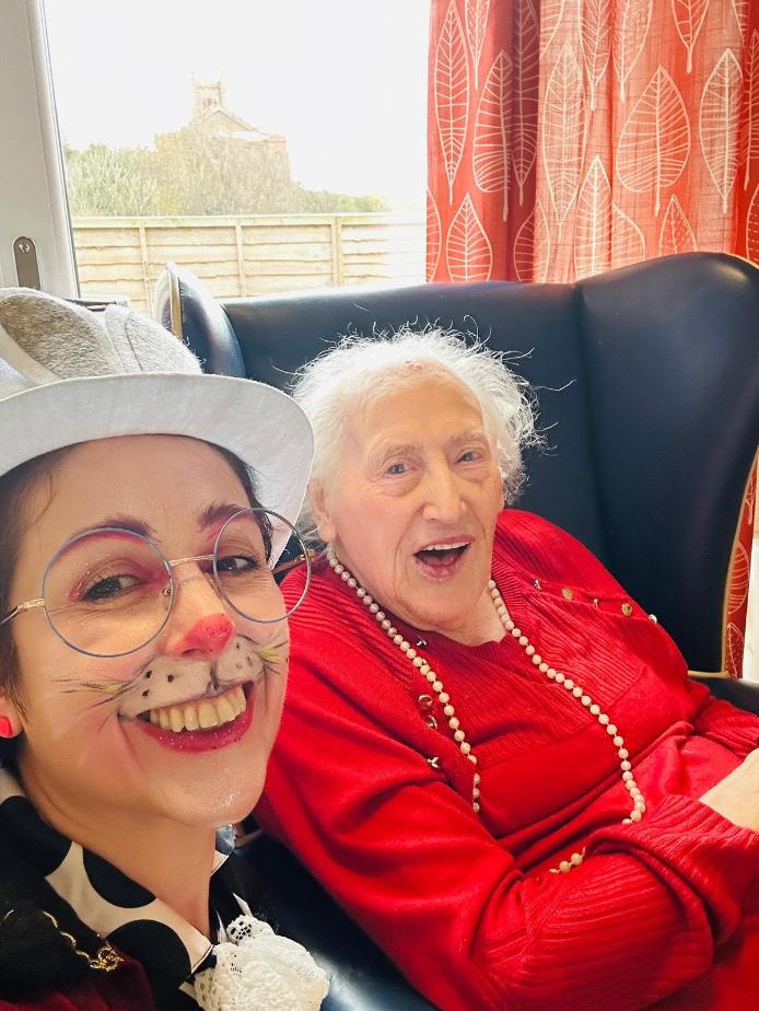 staff and resident taking a selfie for easter