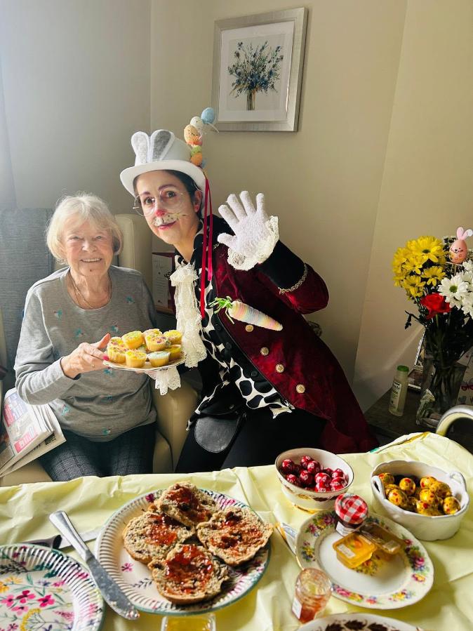 staff and resident taking a photo for easter