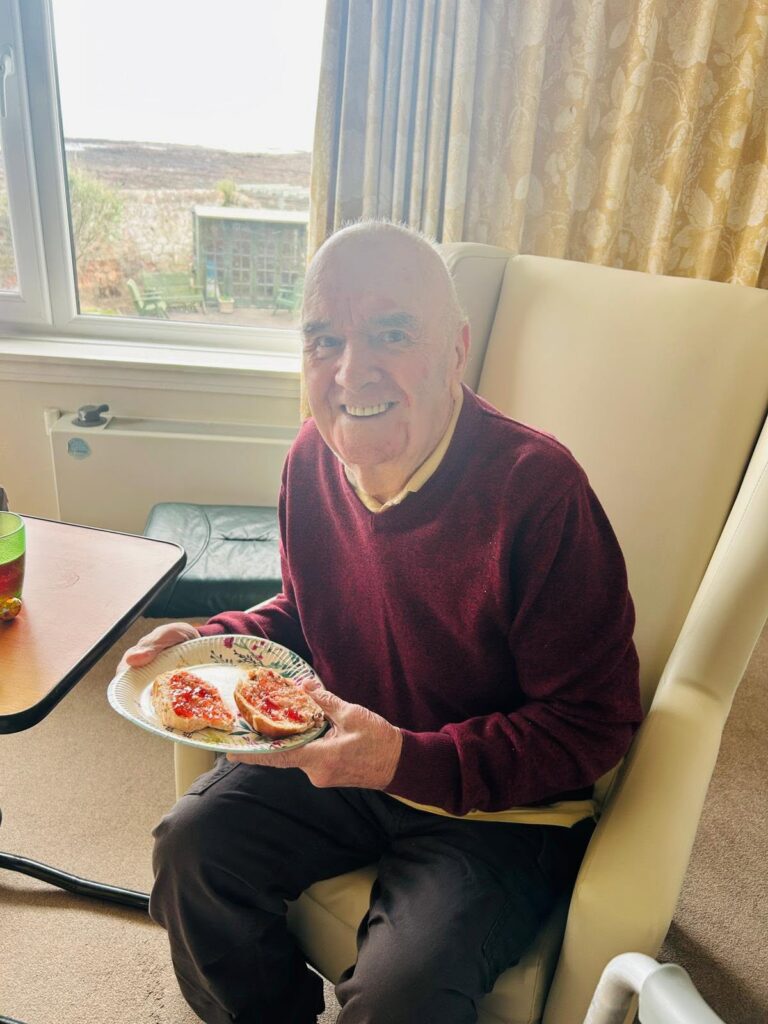 older man with a plate