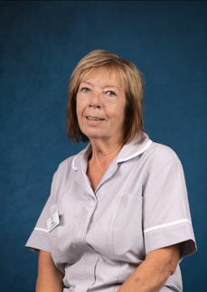 woman in housekeeping uniform