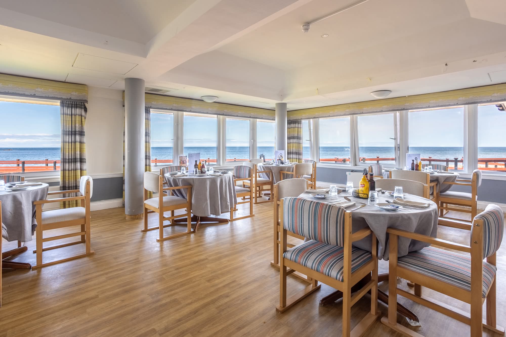 care home dining room with sea views and large windows