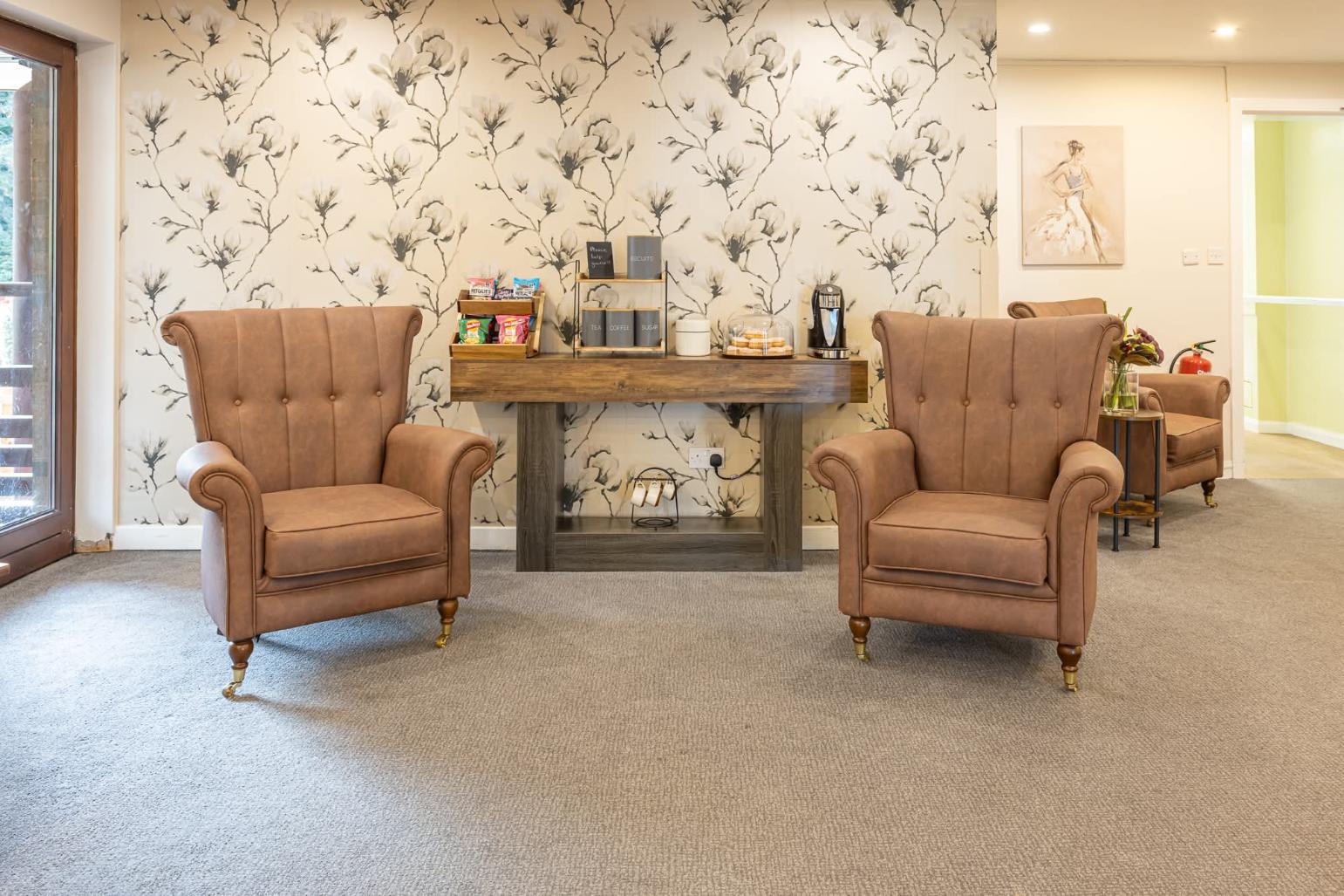 armchairs in care home communal lounge